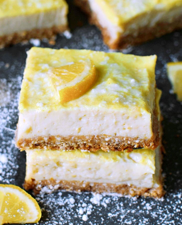 2 vegan cheesecake slices with lemons
