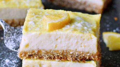 stack of 2 creamy lemon cheesecake bars from the side