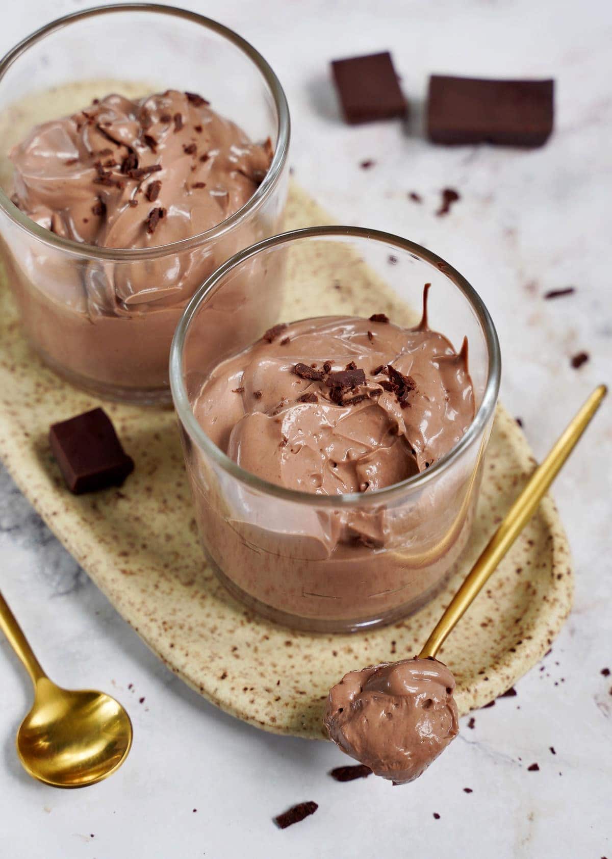 vegan chocolate mousse with spoon from the side