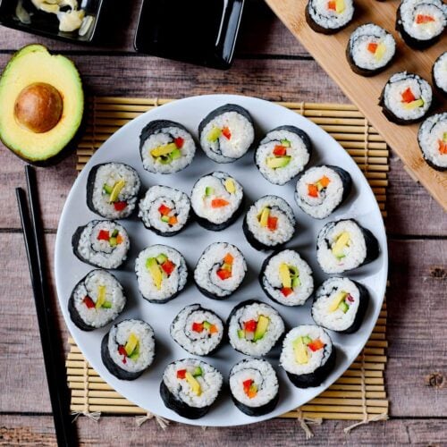 https://elavegan.com/wp-content/uploads/2021/06/vegan-sushi-on-a-white-plate-from-above-500x500.jpg