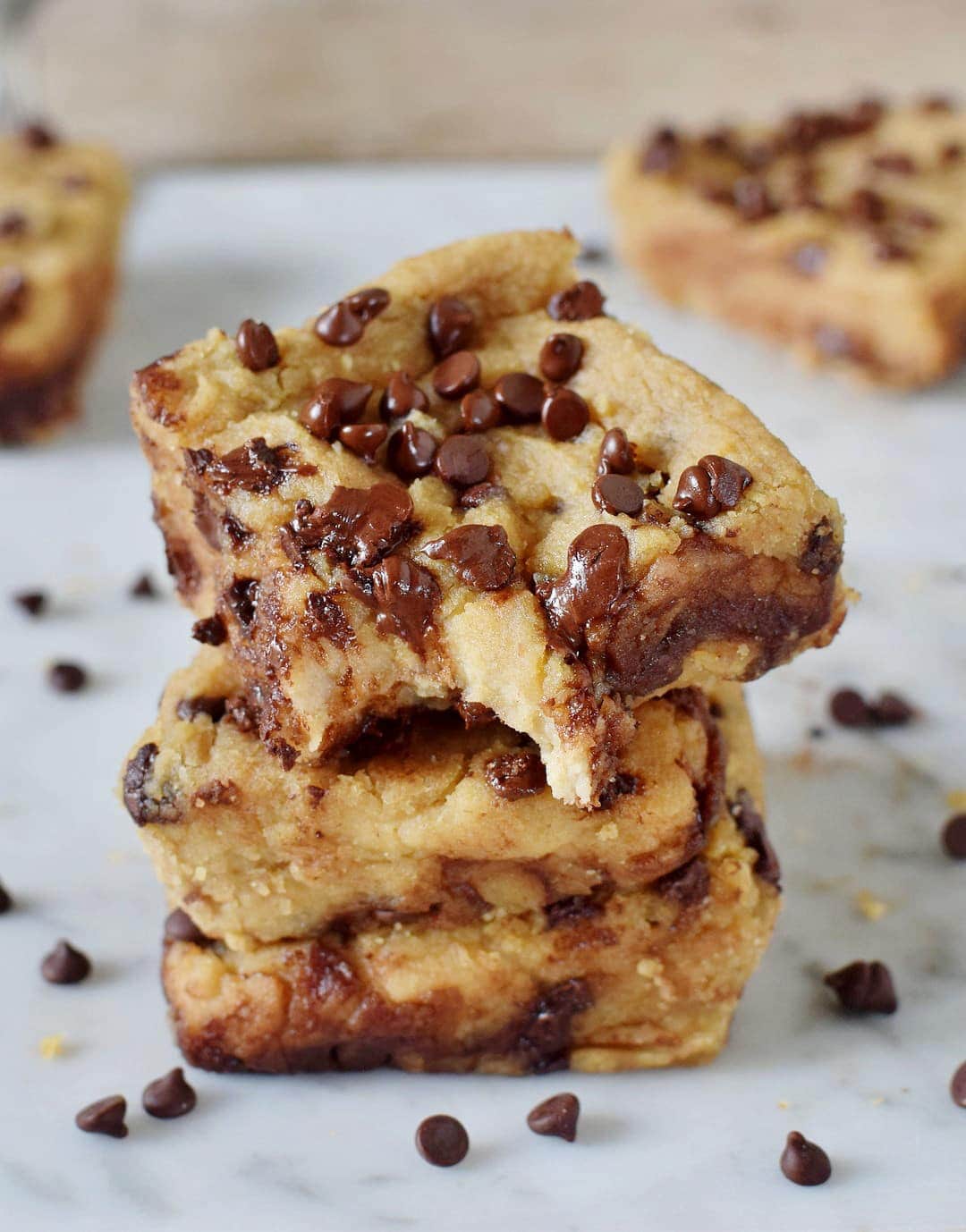 3 stacked gooey chewy chickpea blondies with chocolate chip