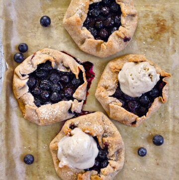 top view of 4 blueberry galettes 2 topped with dairy-free ice cream