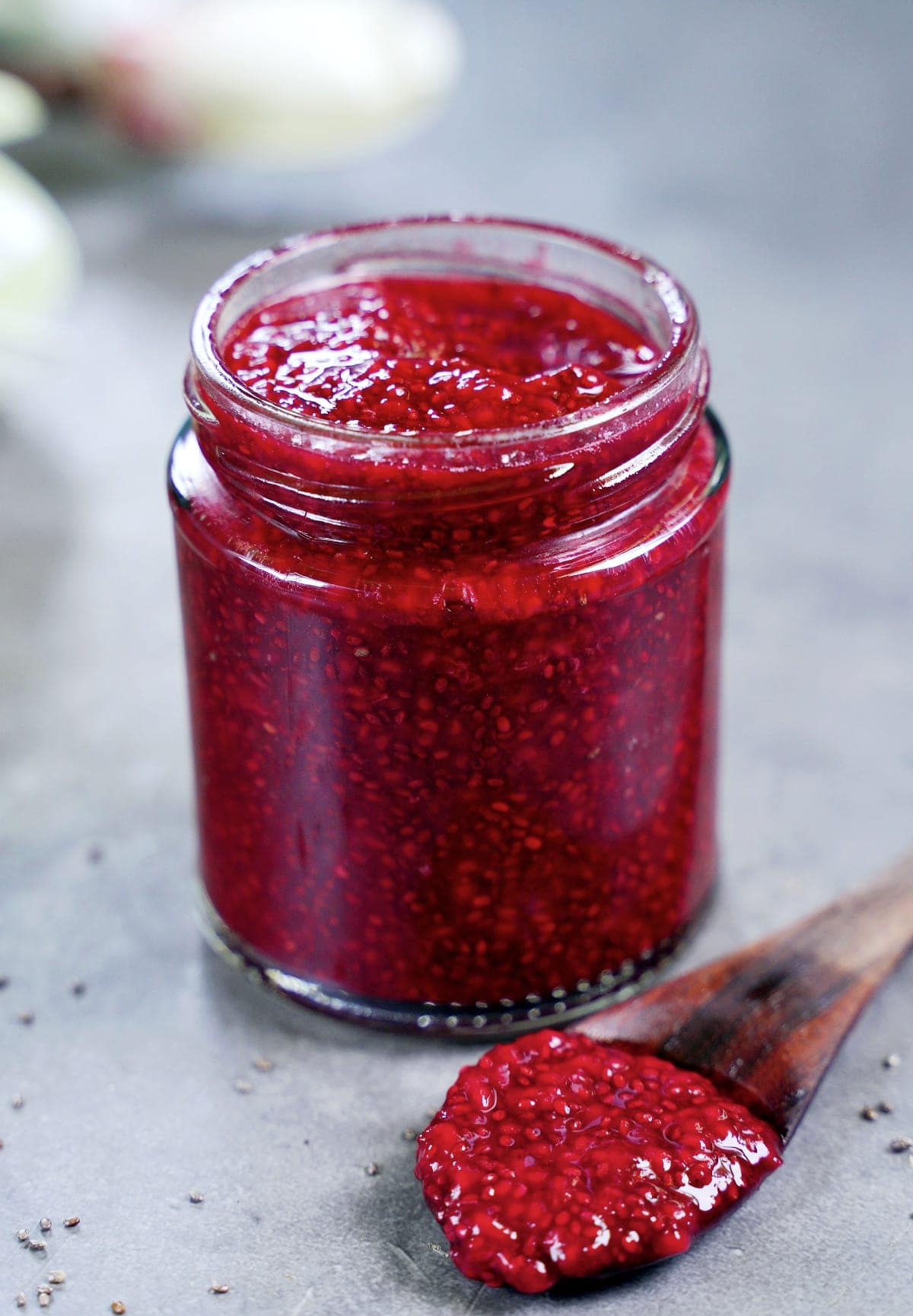 a glass jar filled with healthy chia jam