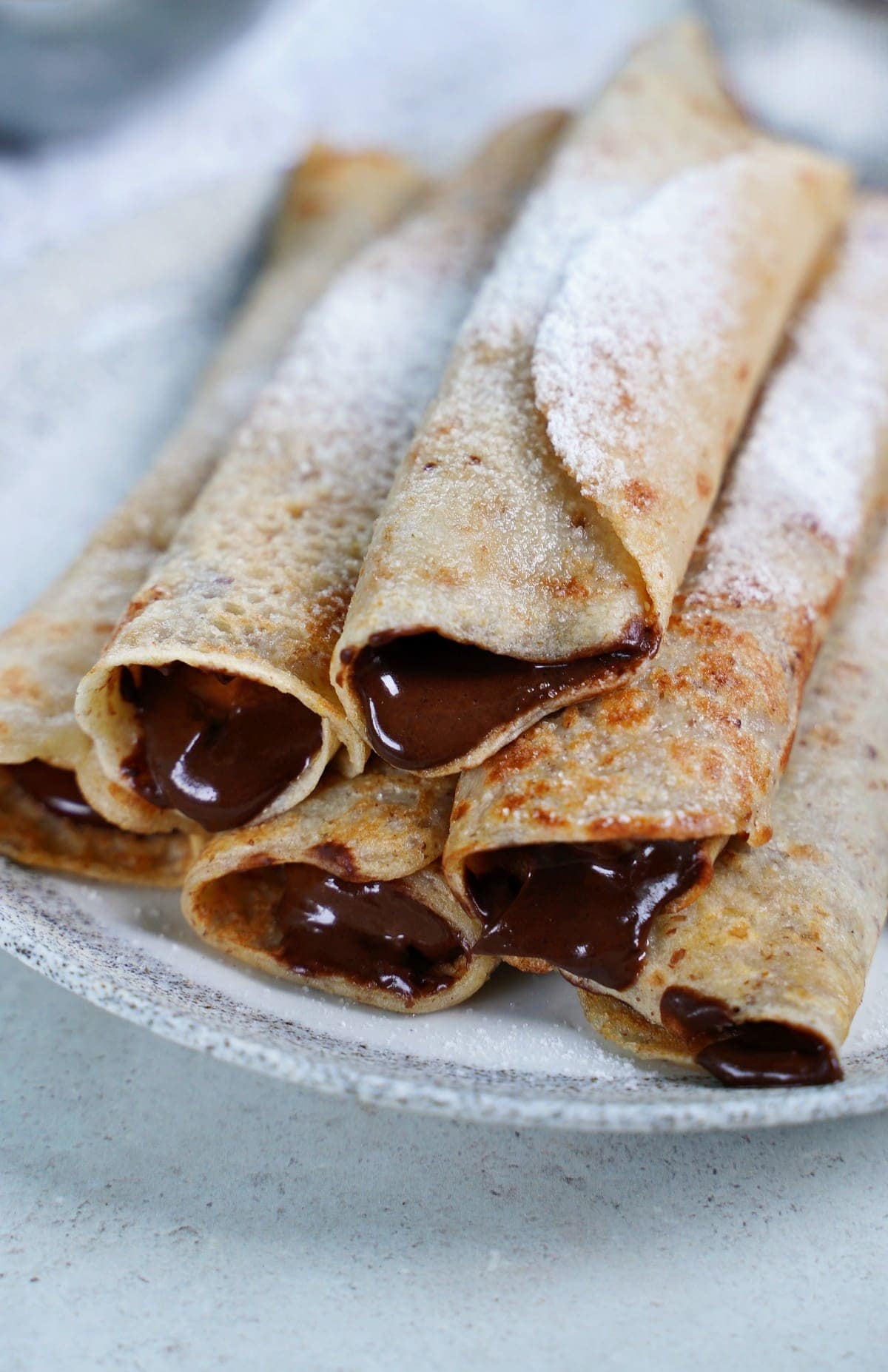 close-up stack of crepes filled with vegan Nutella