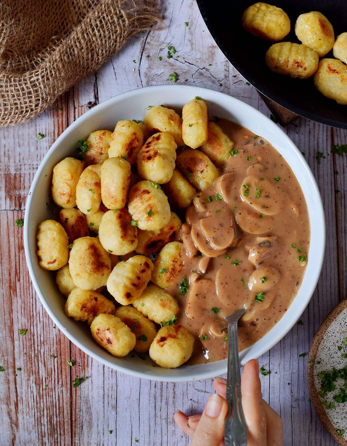 gnocchi in bowl with mushroom Stroganoff from above