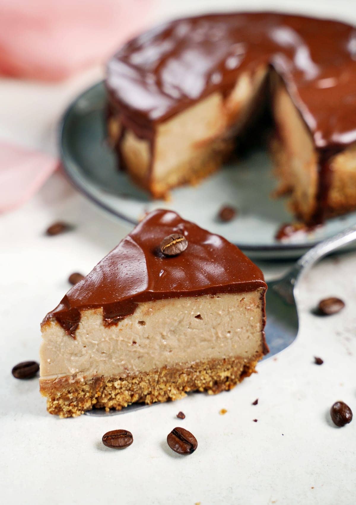 one piece of coffee cheesecake decorated with coffee beans