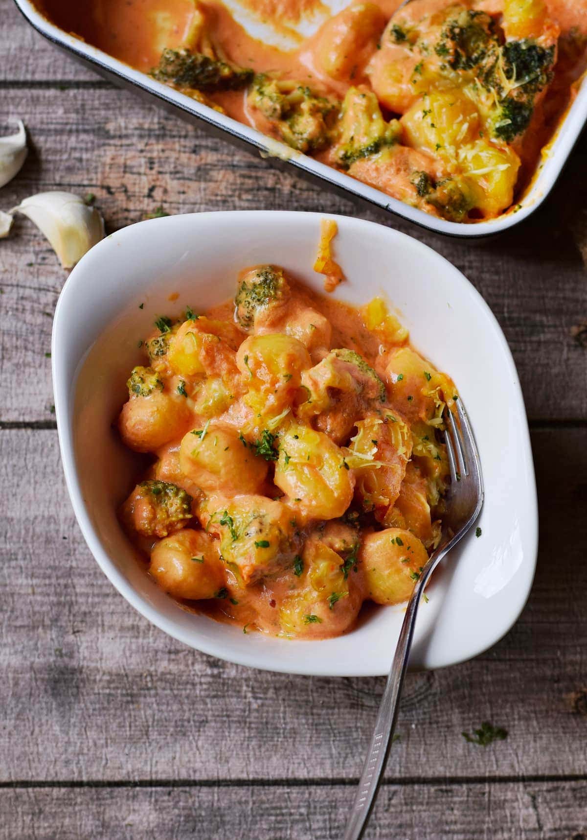 baked gnocchi in white bowl with fork