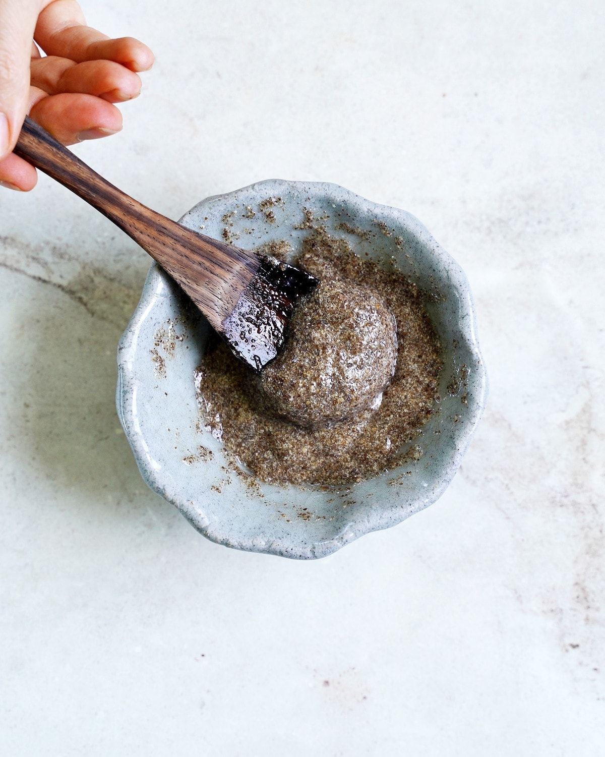 chia eggs with wooden spoon in small bowl