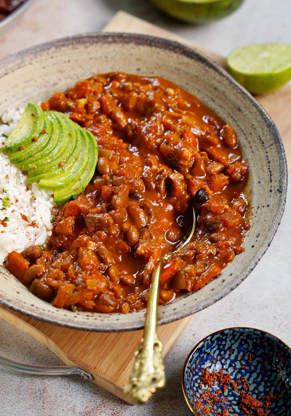 close-up of vegetarian chilli with rice and avocado