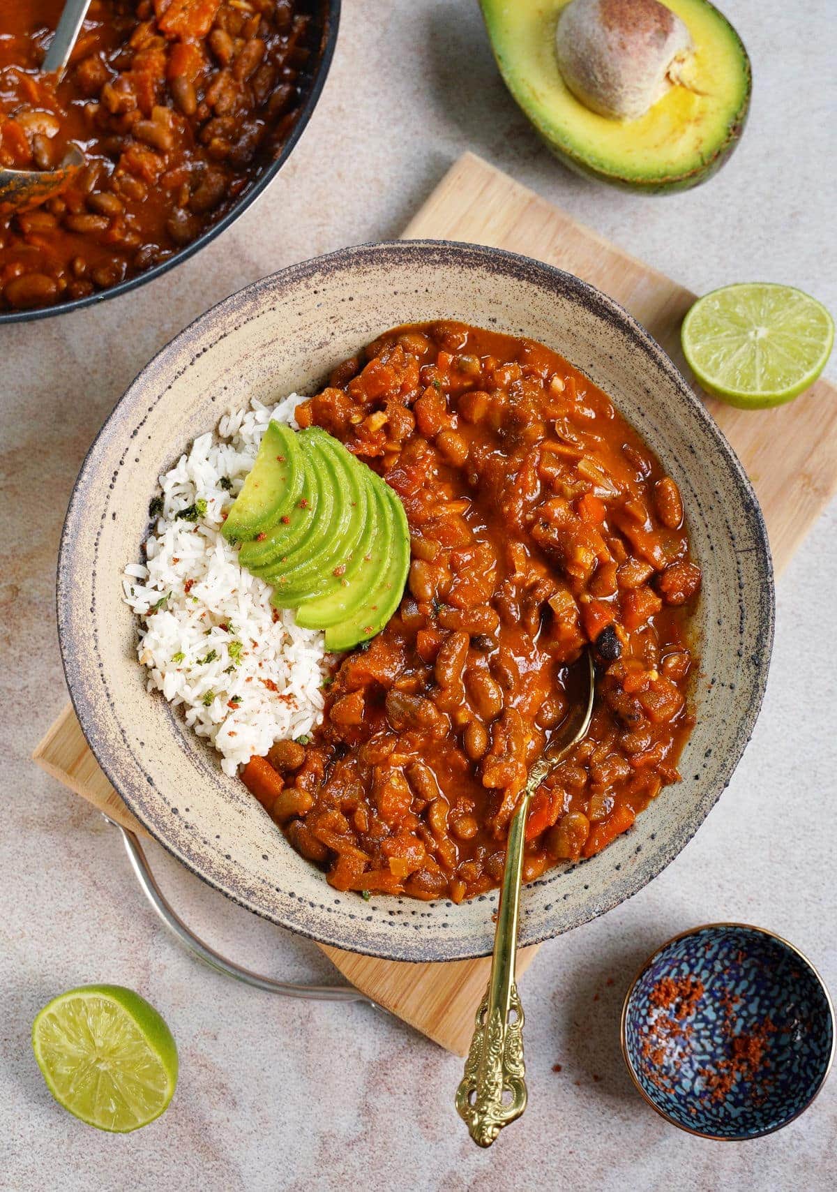 top shot of vegan chili sin carne with rice and avocado