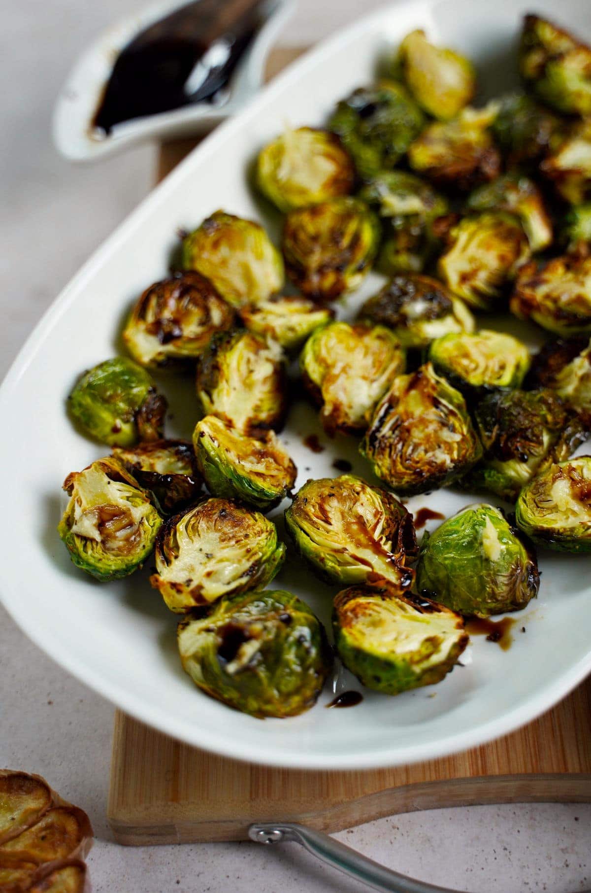 close-up of air fried Brussels sprouts on white plate