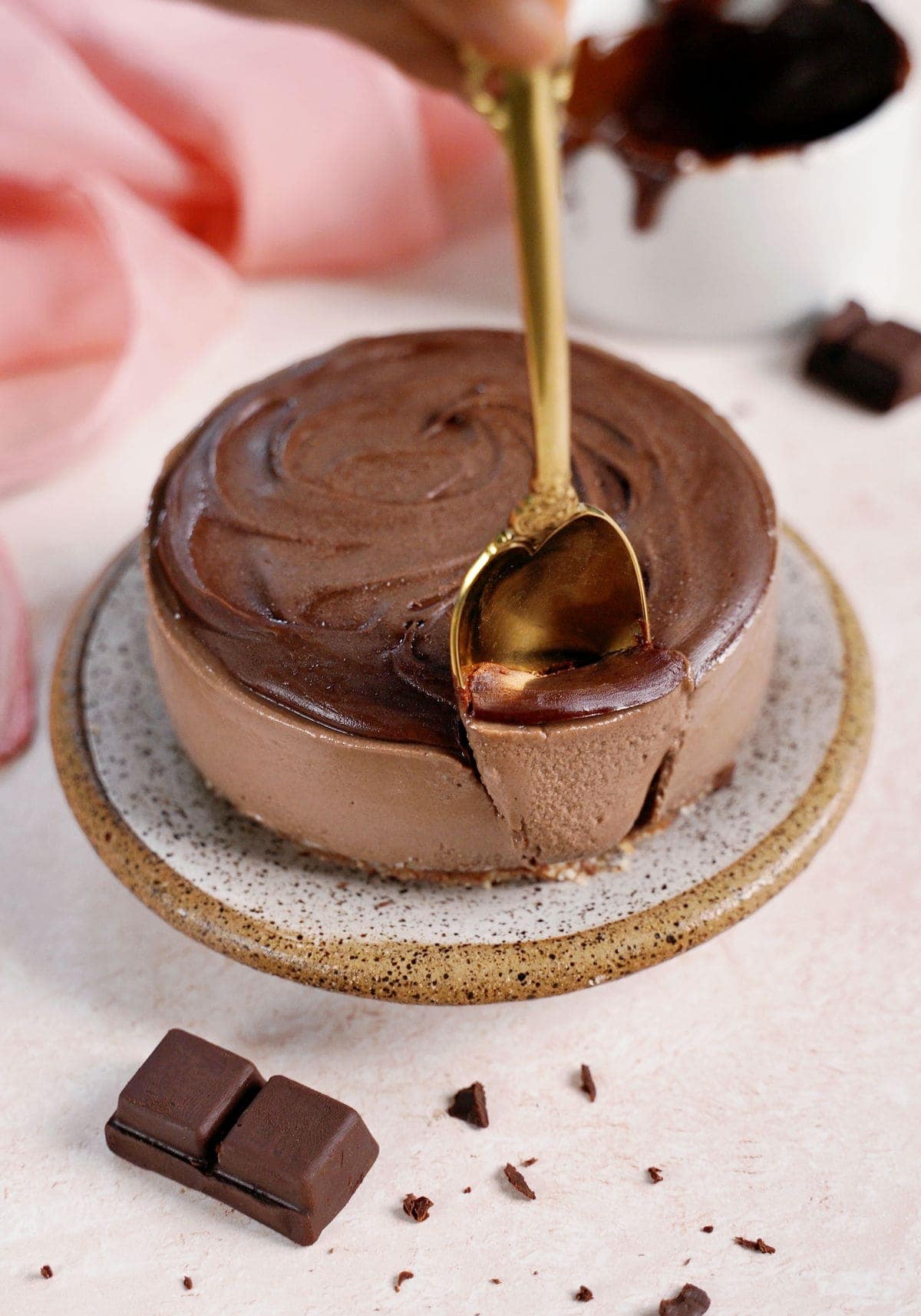 spoon submerged in vegan chocolate mousse cake