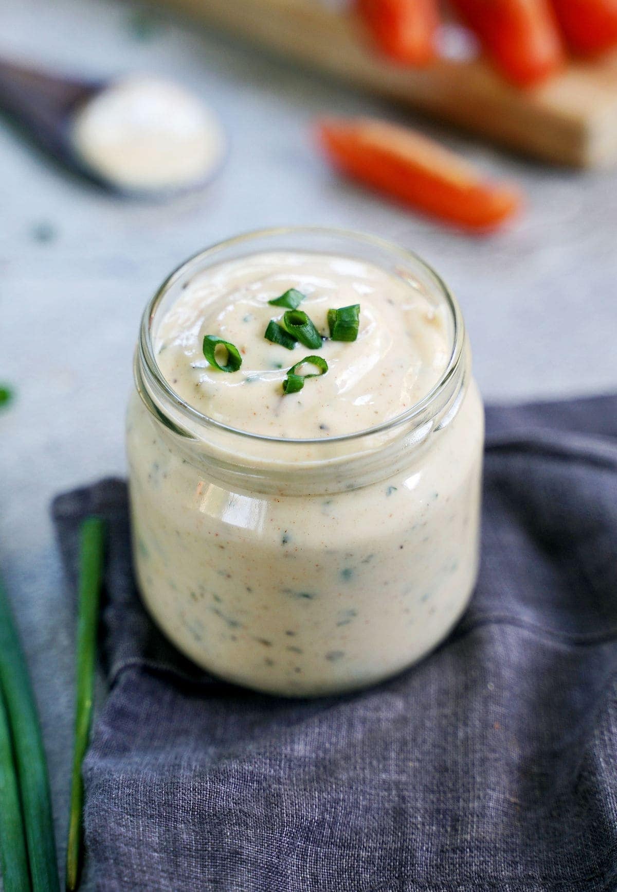 vegan ranch dressing in glass jar with chives