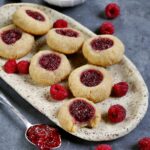 vegan raspberry thumbprint cookies with spoon
