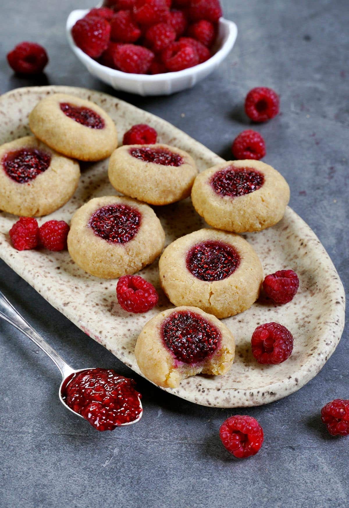 vegan raspberry thumbprint cookies with spoon