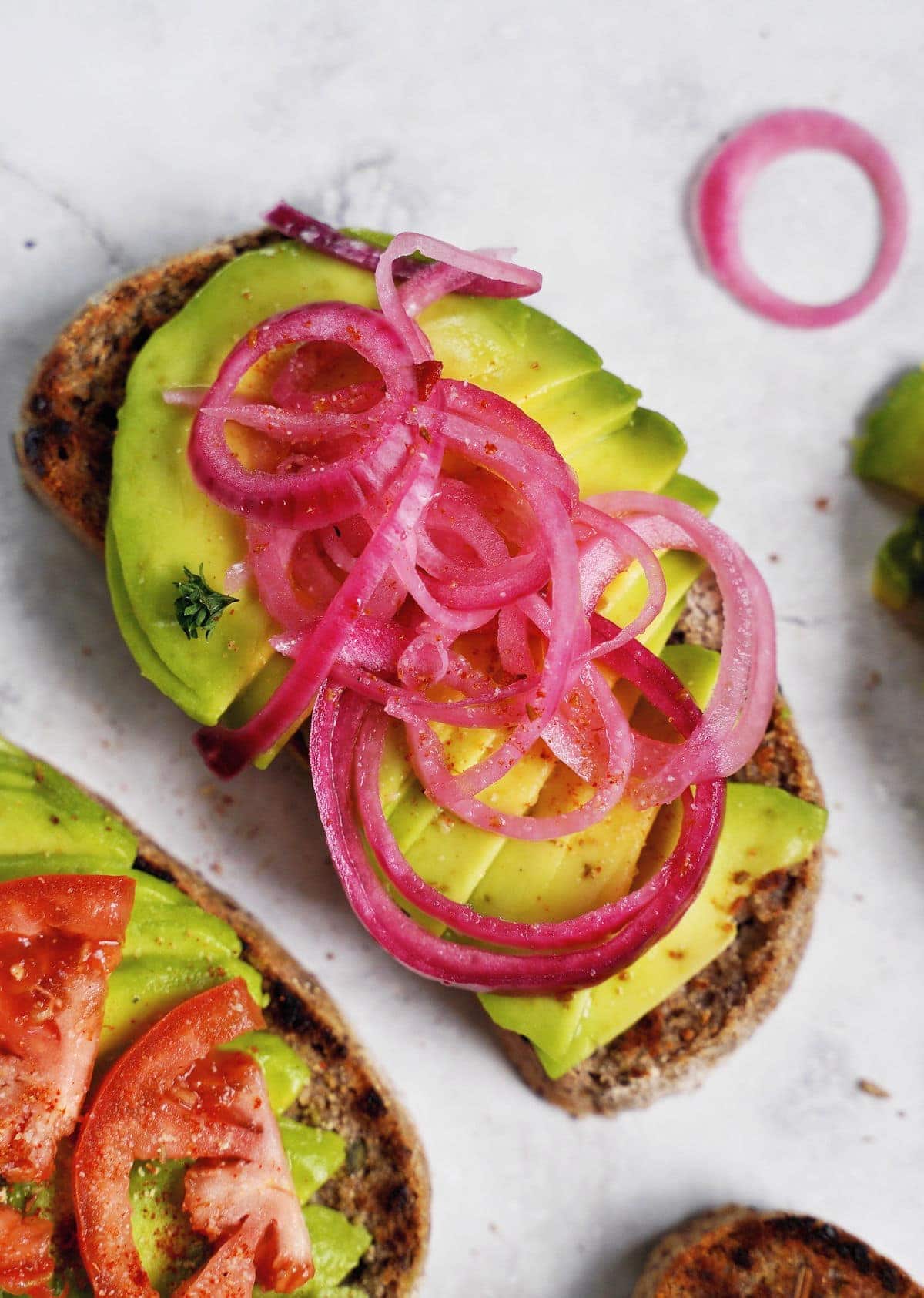 avocado toast with pink onion slices