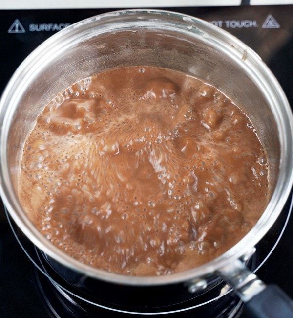 simmering dairy-free chocolate in saucepan