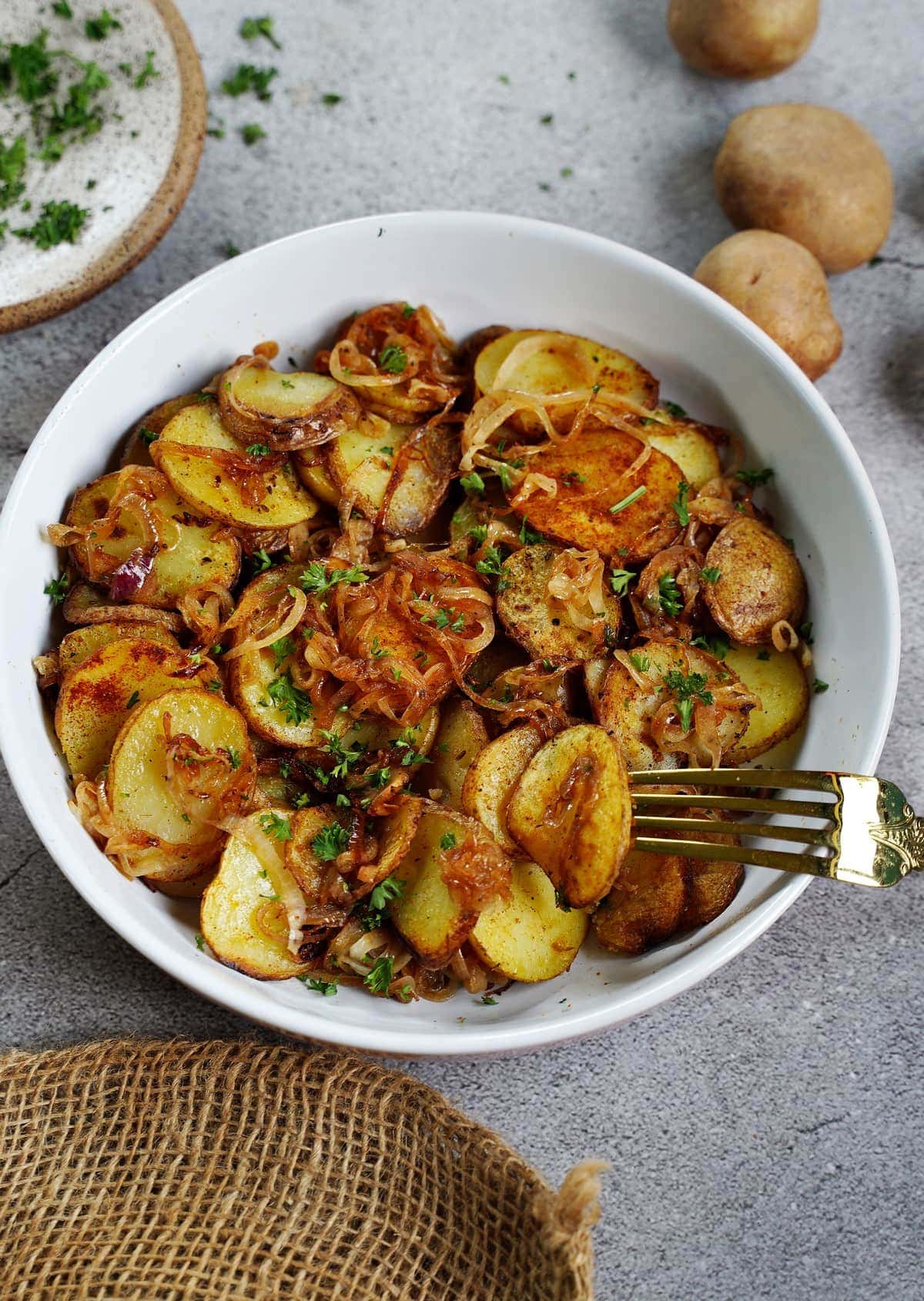Lyonnaise Potatoes in white bowl