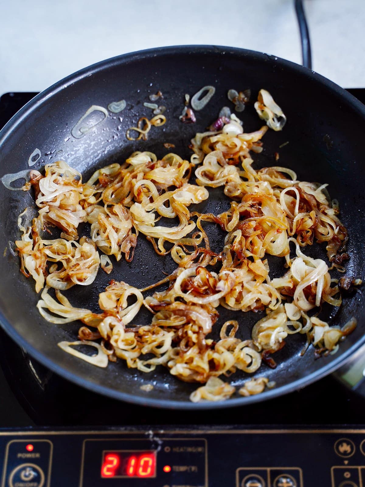 caramelized onions in black frying pan