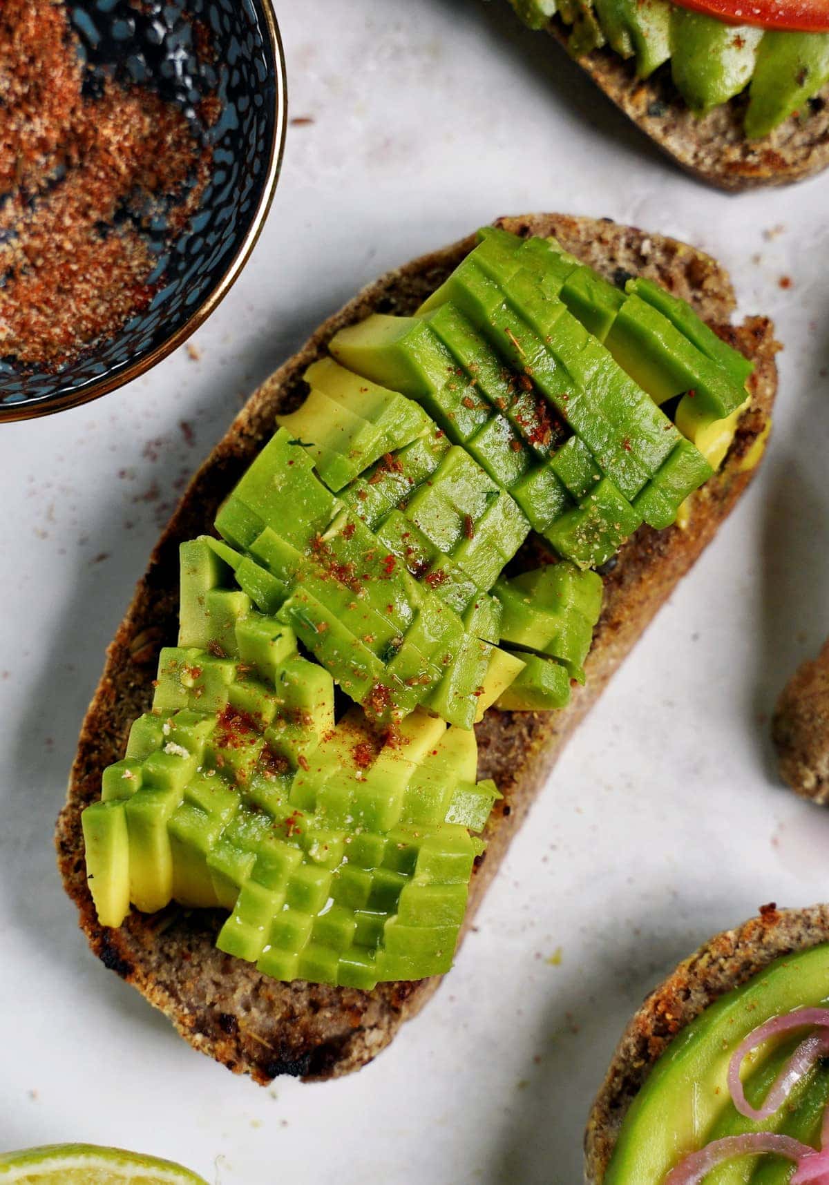 close-up of bread with pixelated avocado