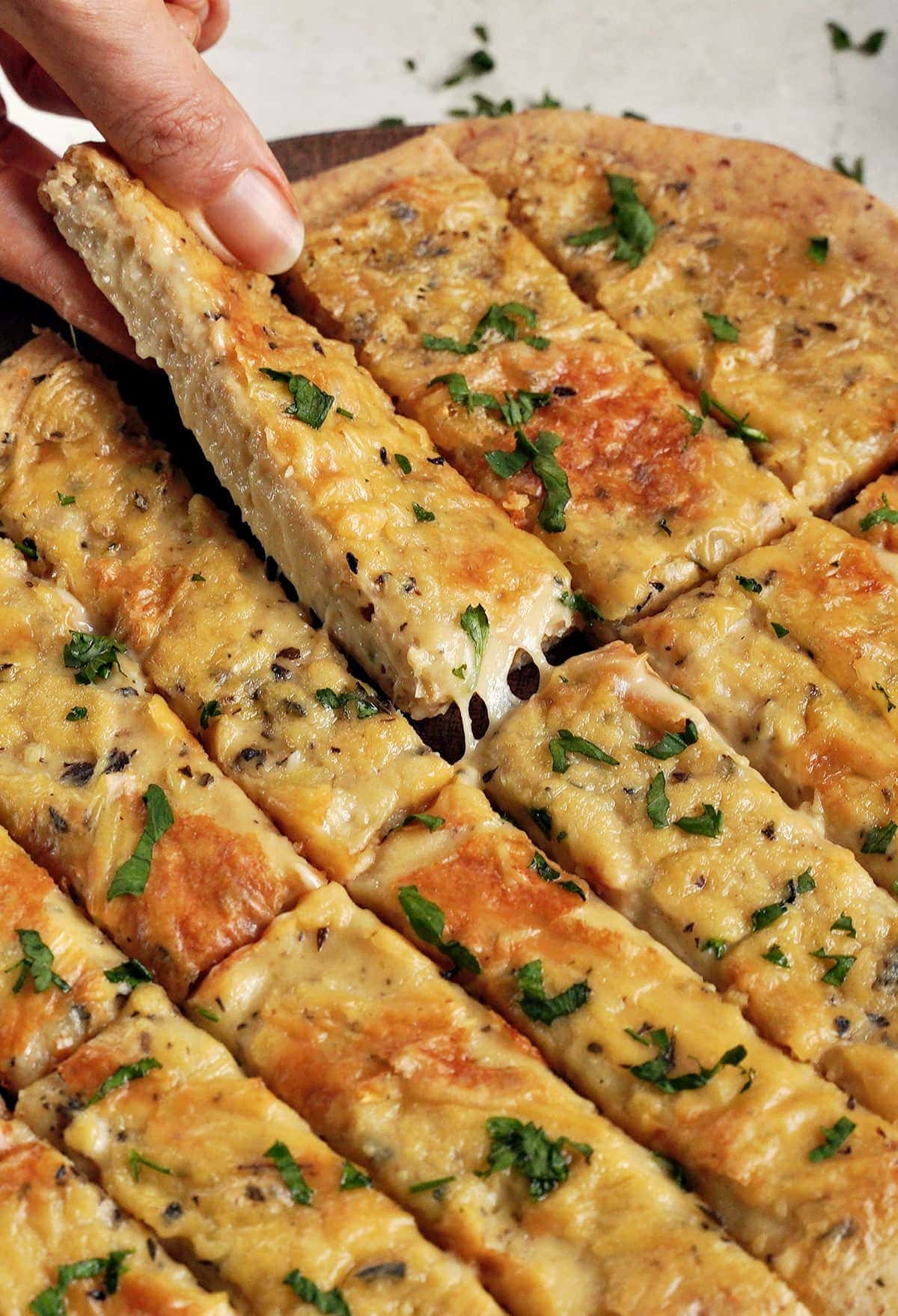 close-up of cheesy garlic pizza breadsticks