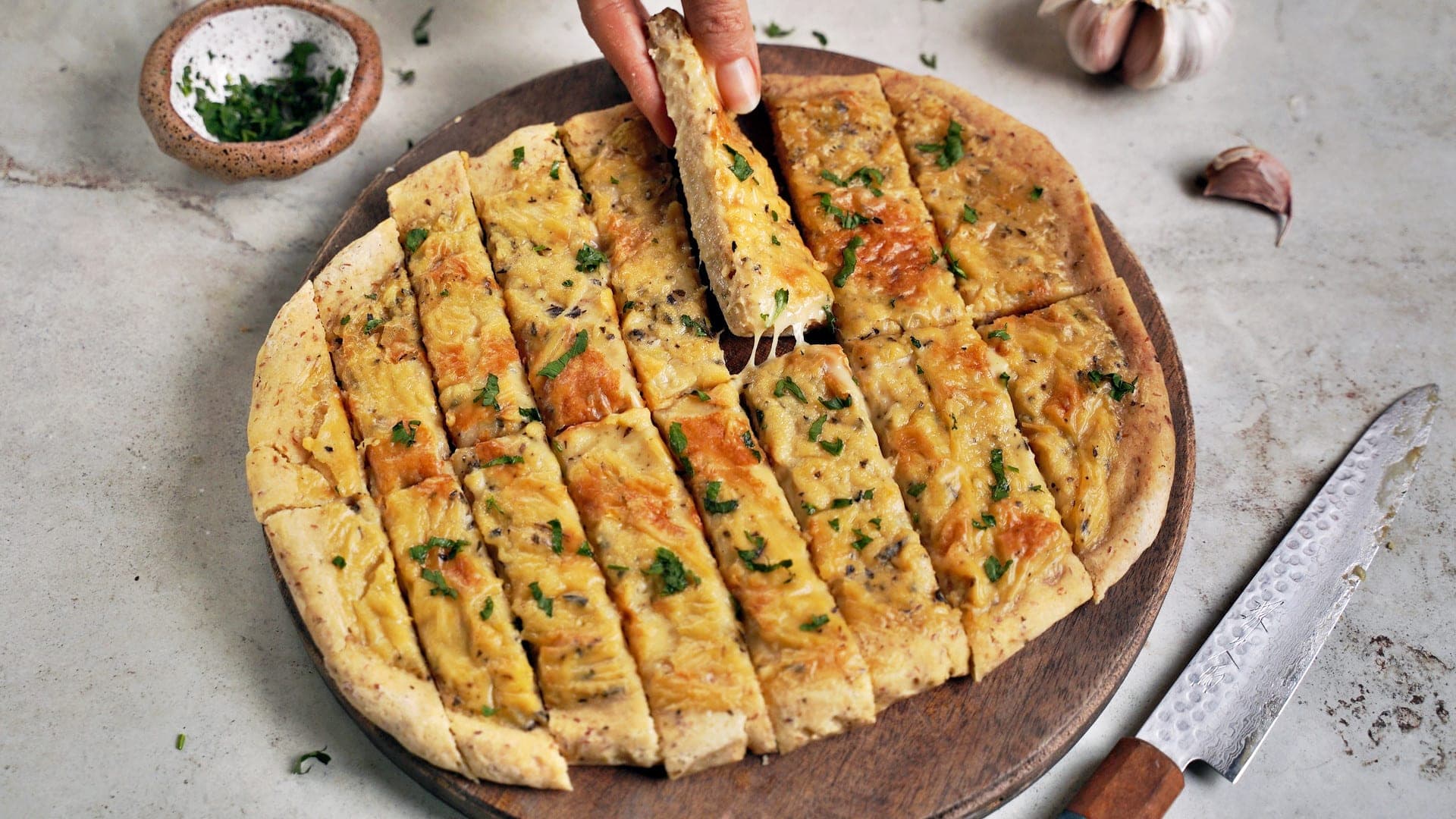 horizontal shot of cheesy garlic pizza dough breadsticks