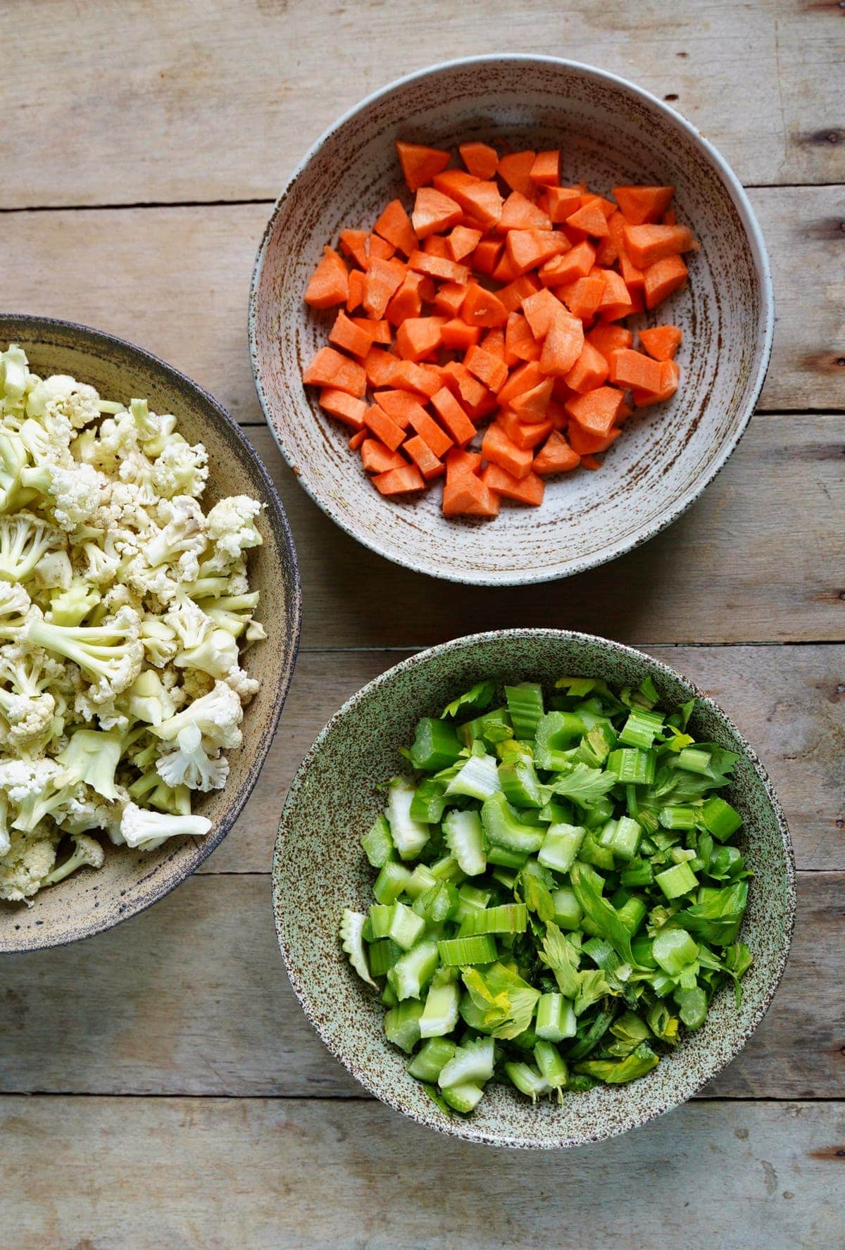cauliflower carrot and celery in bowls