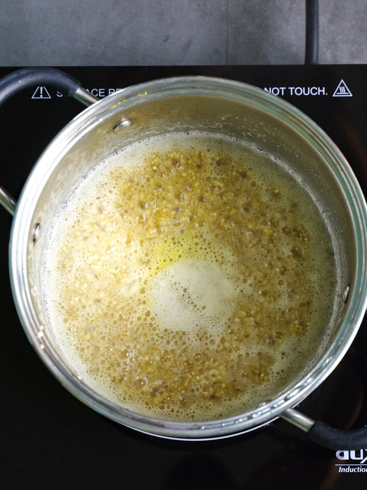 cooking quinoa in pot with water