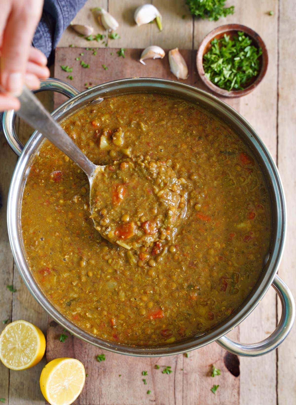 lentil stew in large pot with ladle