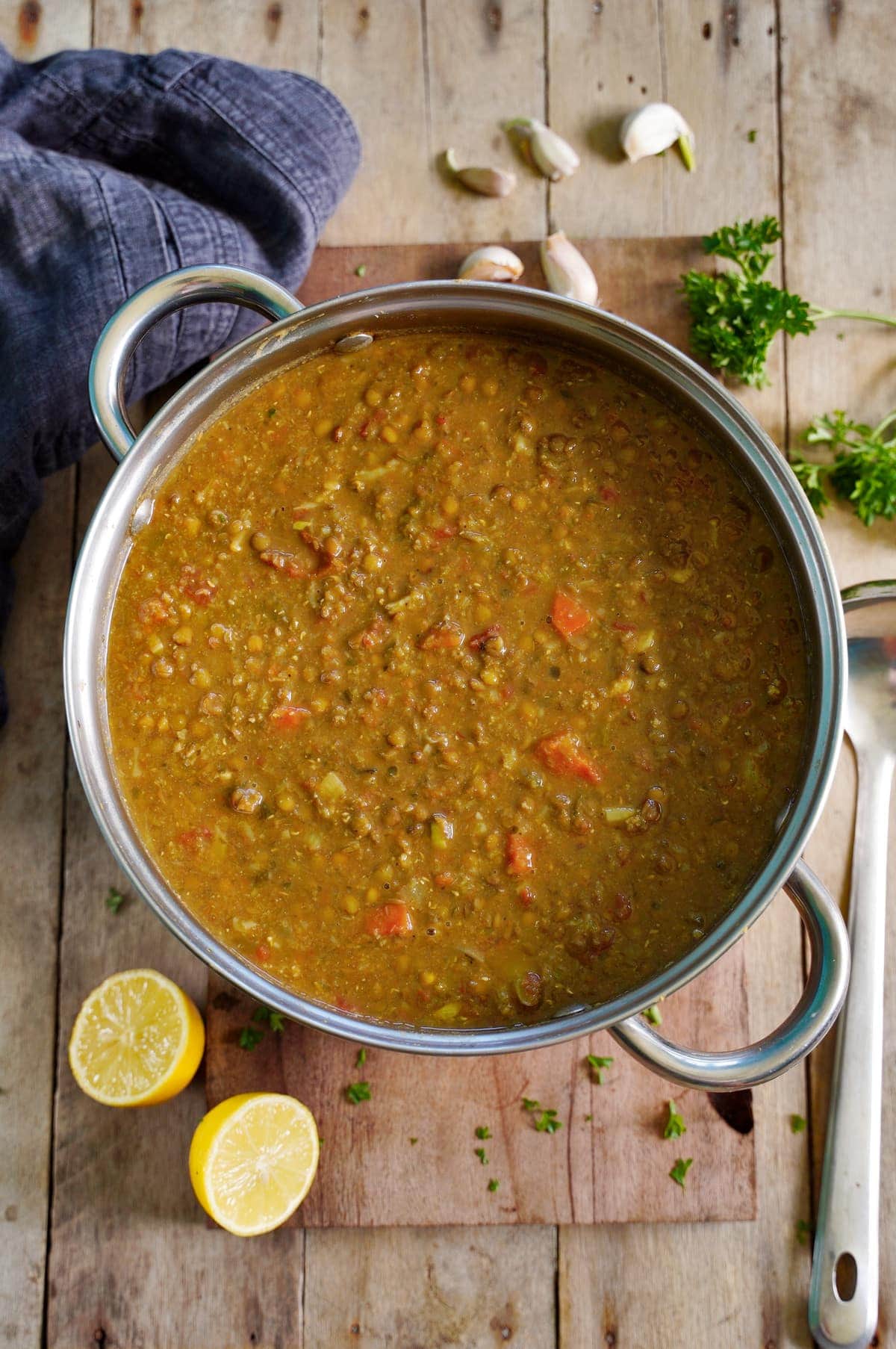 plain lentil soup in large pot on wooden board