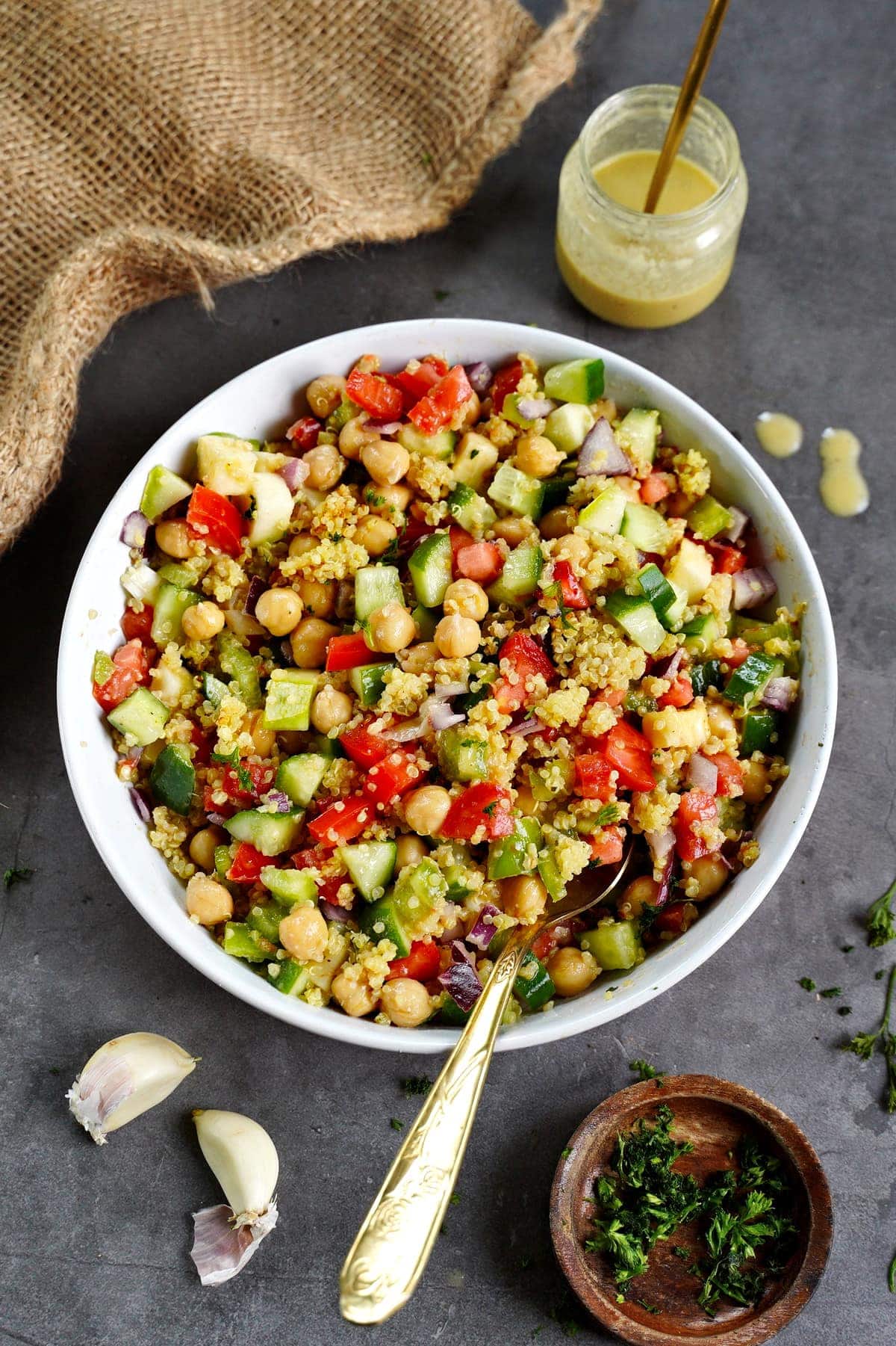 quinoa salad with veggies in bowl with spoon