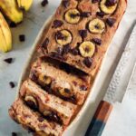 sliced sugar-free banana bread from above with chocolate chunks