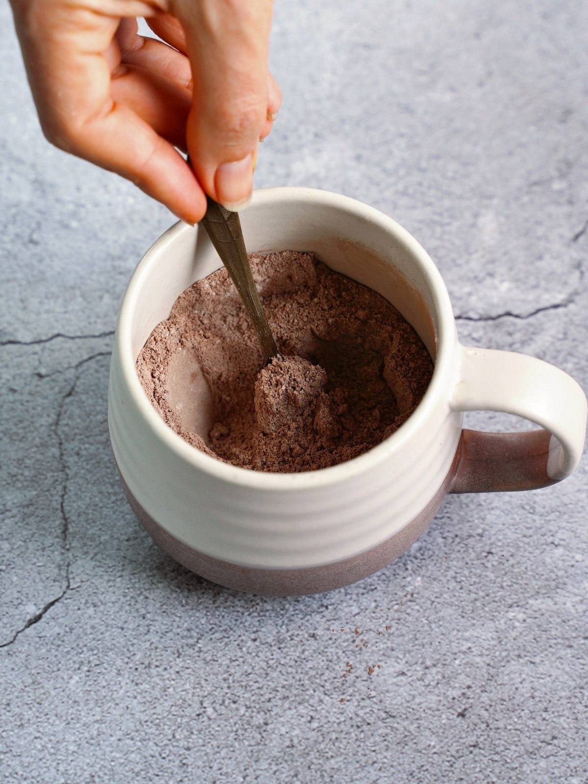 stirring dry ingredients in mug