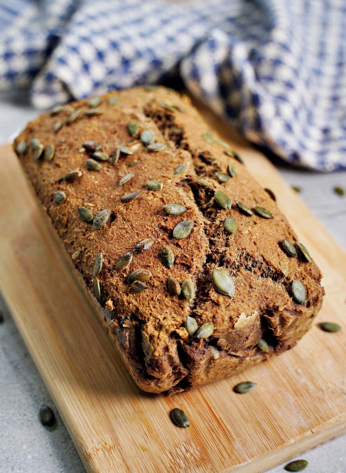 baked loaf of healthy protein bread with pumpkin seeds