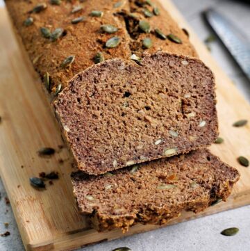 close-up of healthy protein bread with pumpkin seeds on wooden board