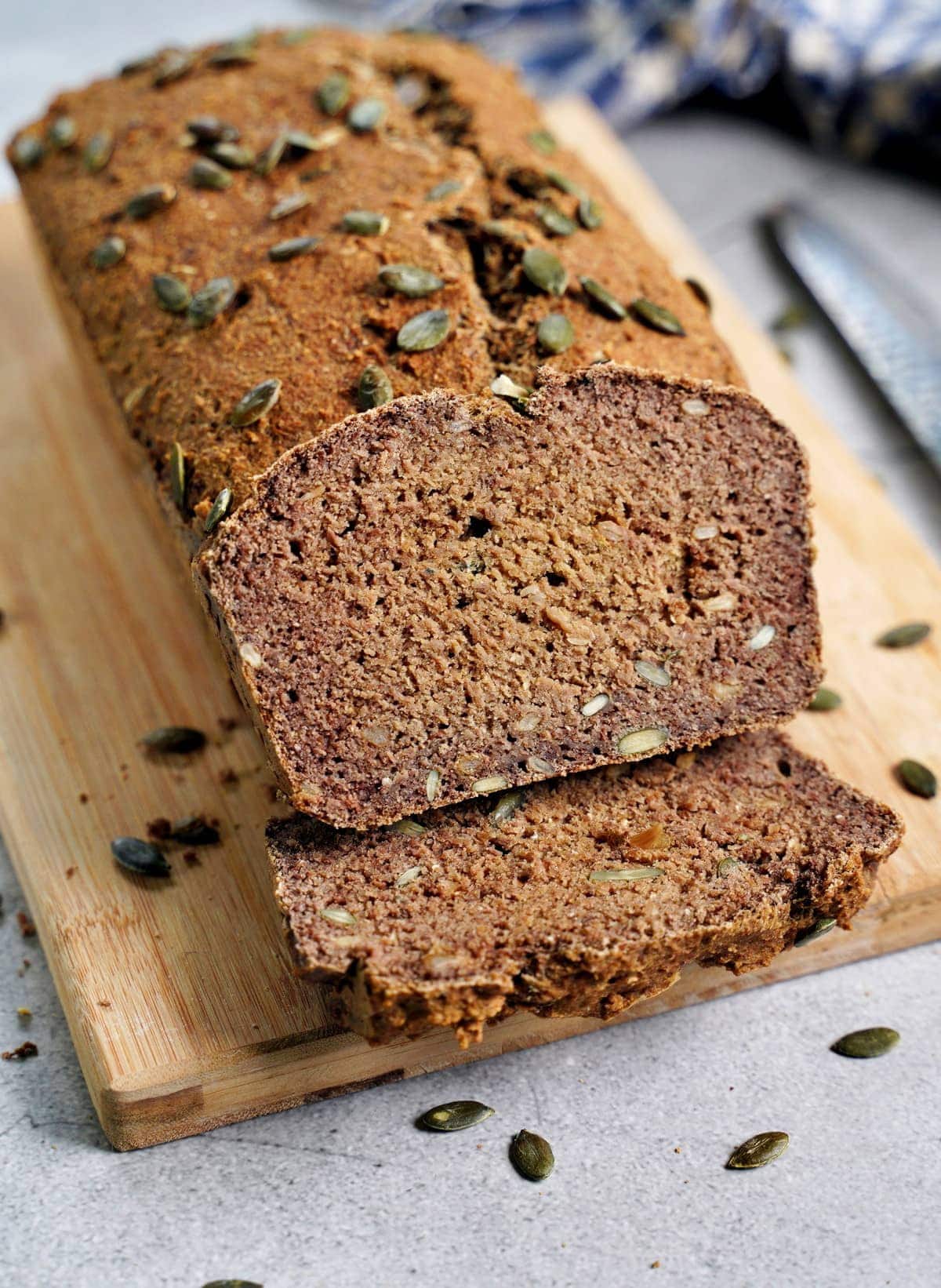 close-up of healthy lentil bread with pumpkin seeds on wooden board