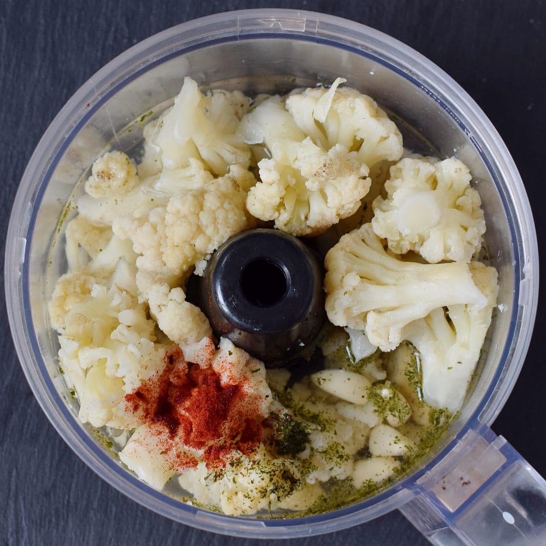 cooked cauliflower and spices in food processor