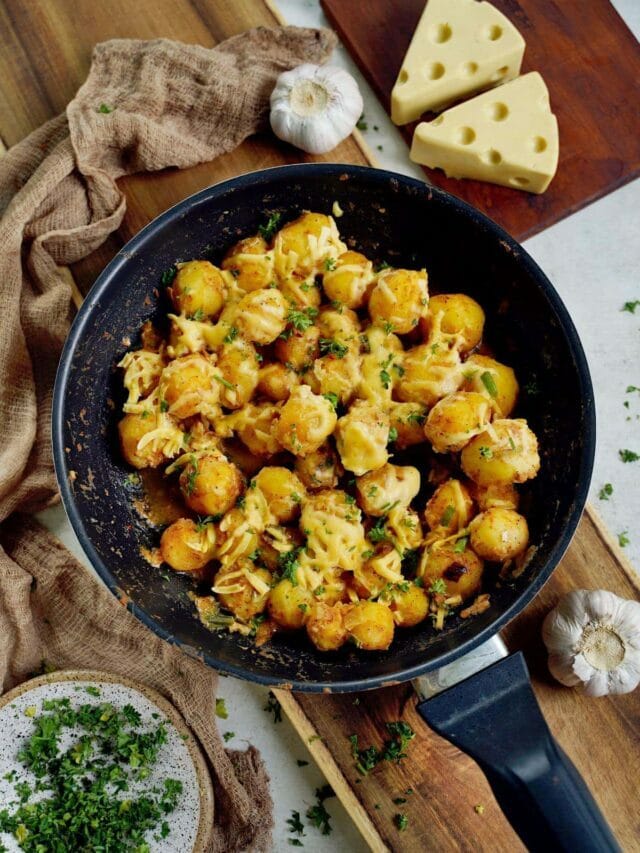 Cheesy Boiled Baby Potatoes in a Skillet