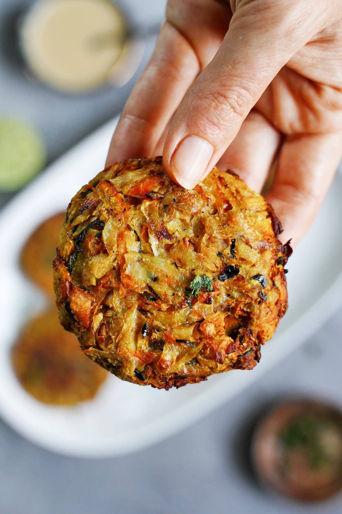 hand holding a cooked veggie fritter