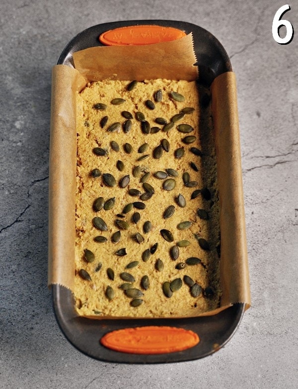 lentil batter with pumpkin seeds in lined loaf pan