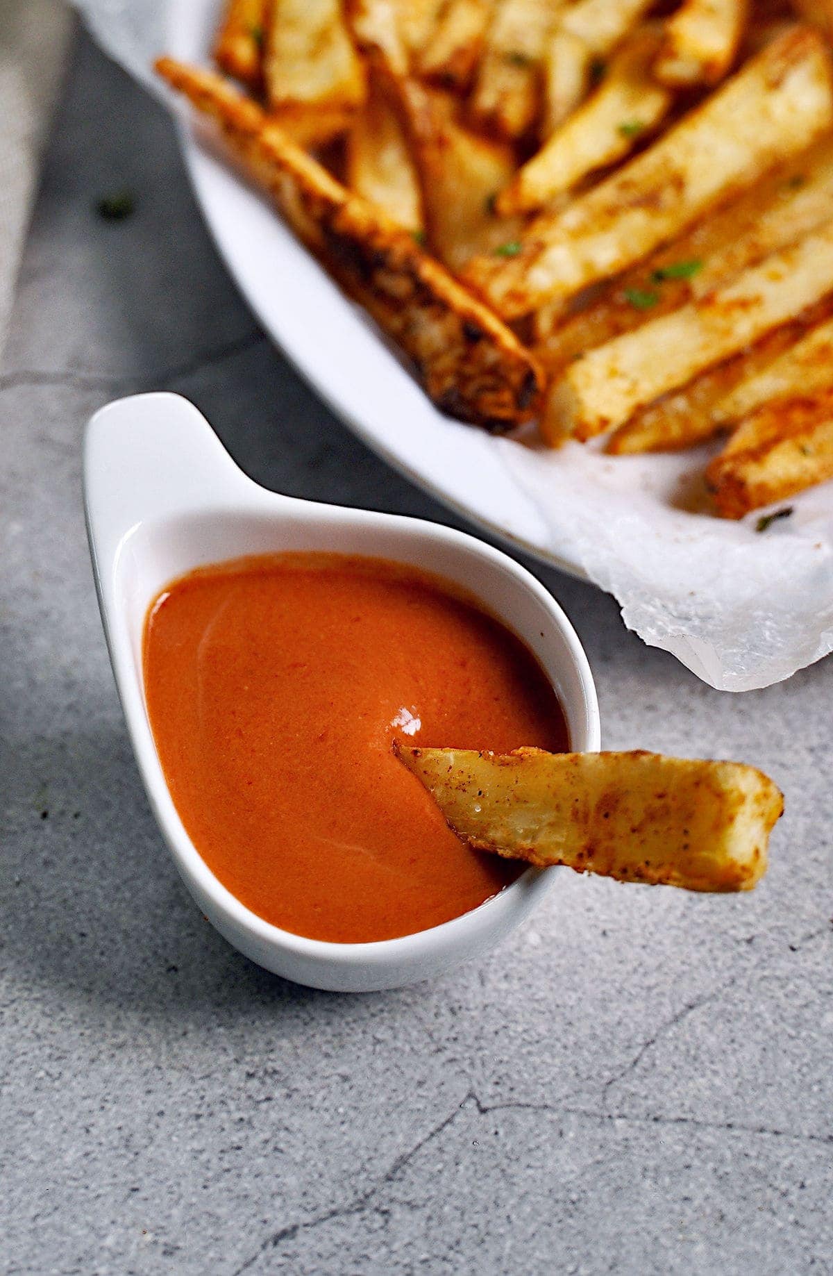 close-up of cassava fries in red dip