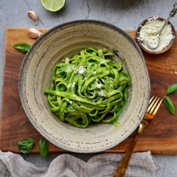 cropped-spinach-and-basil-pasta-with-dairy-free-Parmesan-cheese-in-bowl-from-above.jpg