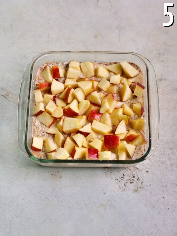 oatmeal in pan topped with apple slices