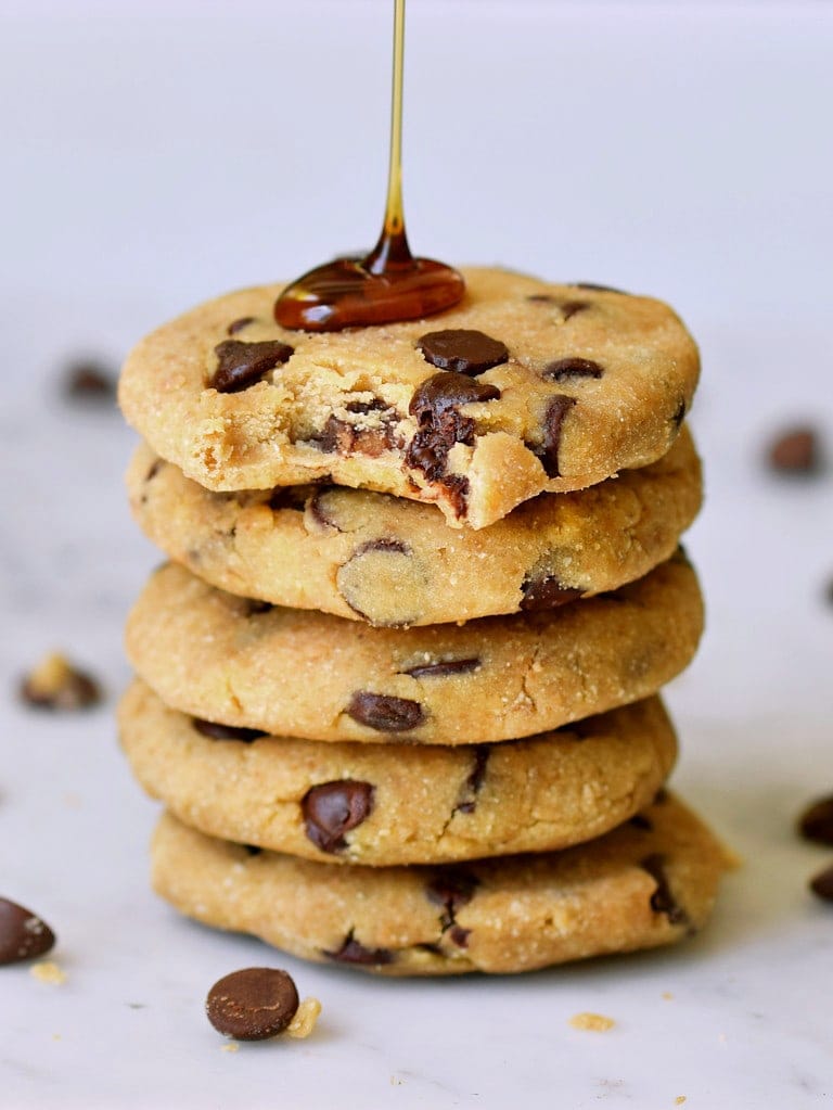 stack of vegan baked chocolate chip cookies with drizzle