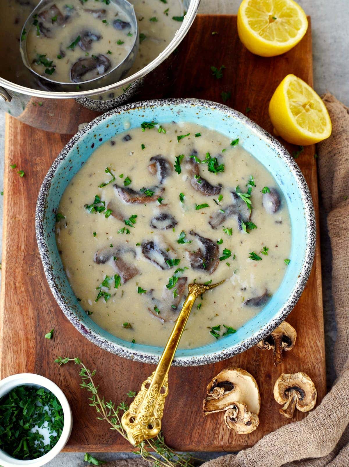 vegan cream of mushroom soup in bowl with spoon