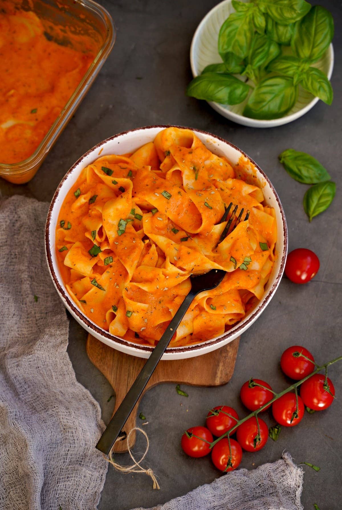pappardelle in vegetable cream cheese sauce with tomatoes and basil