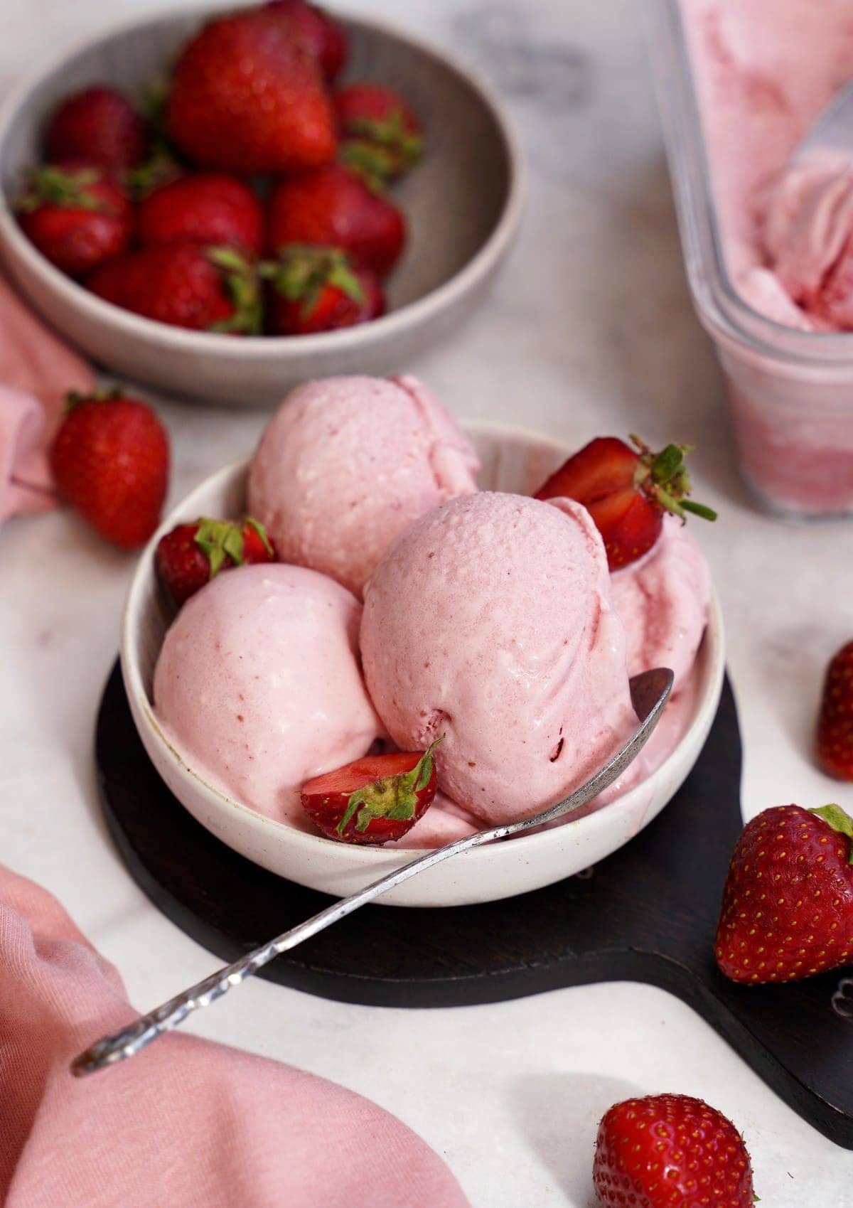 close-up of strawberry ice cream with fresh strawberries