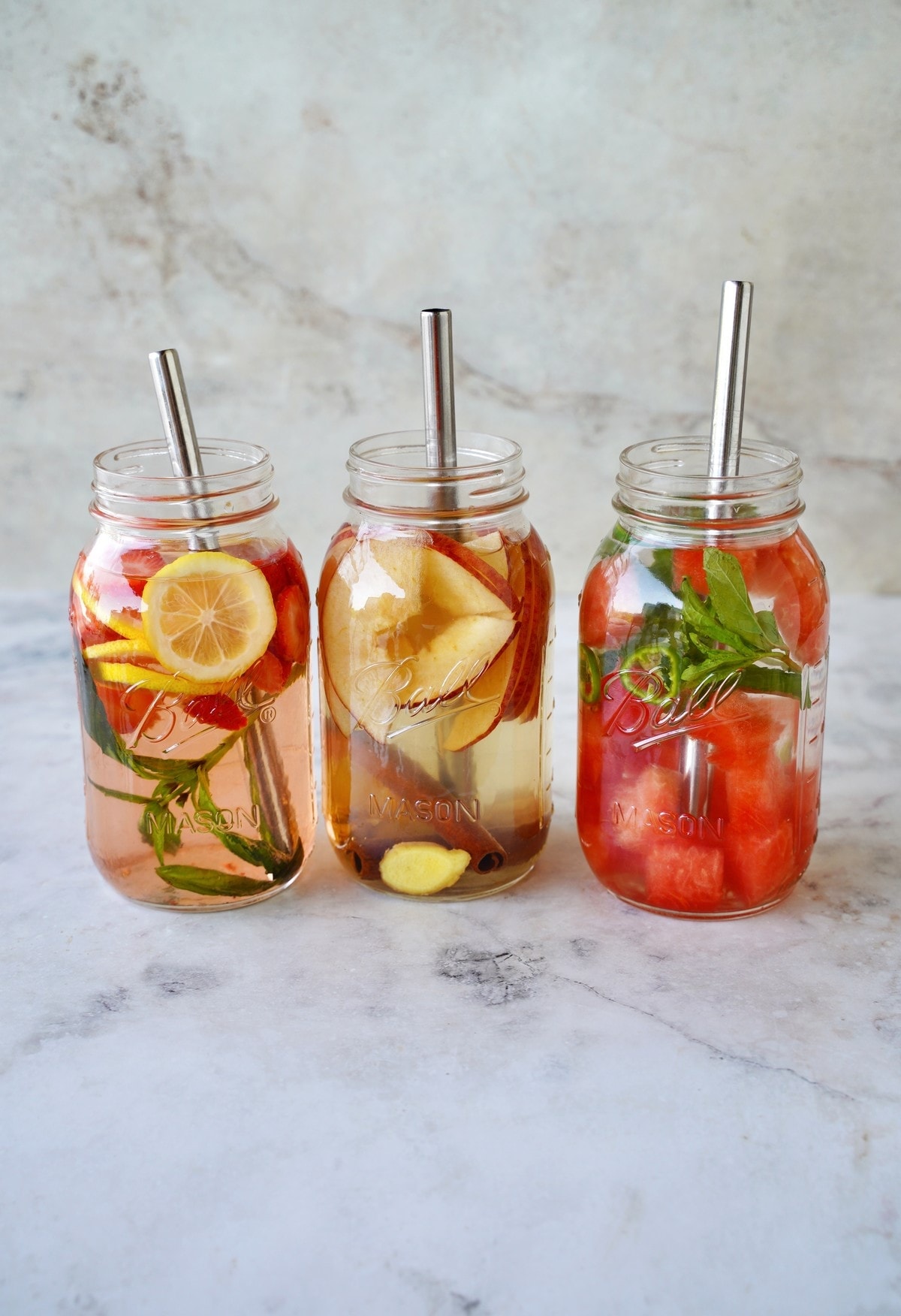 fruit infused water with strawberries lemon apple and watermelon