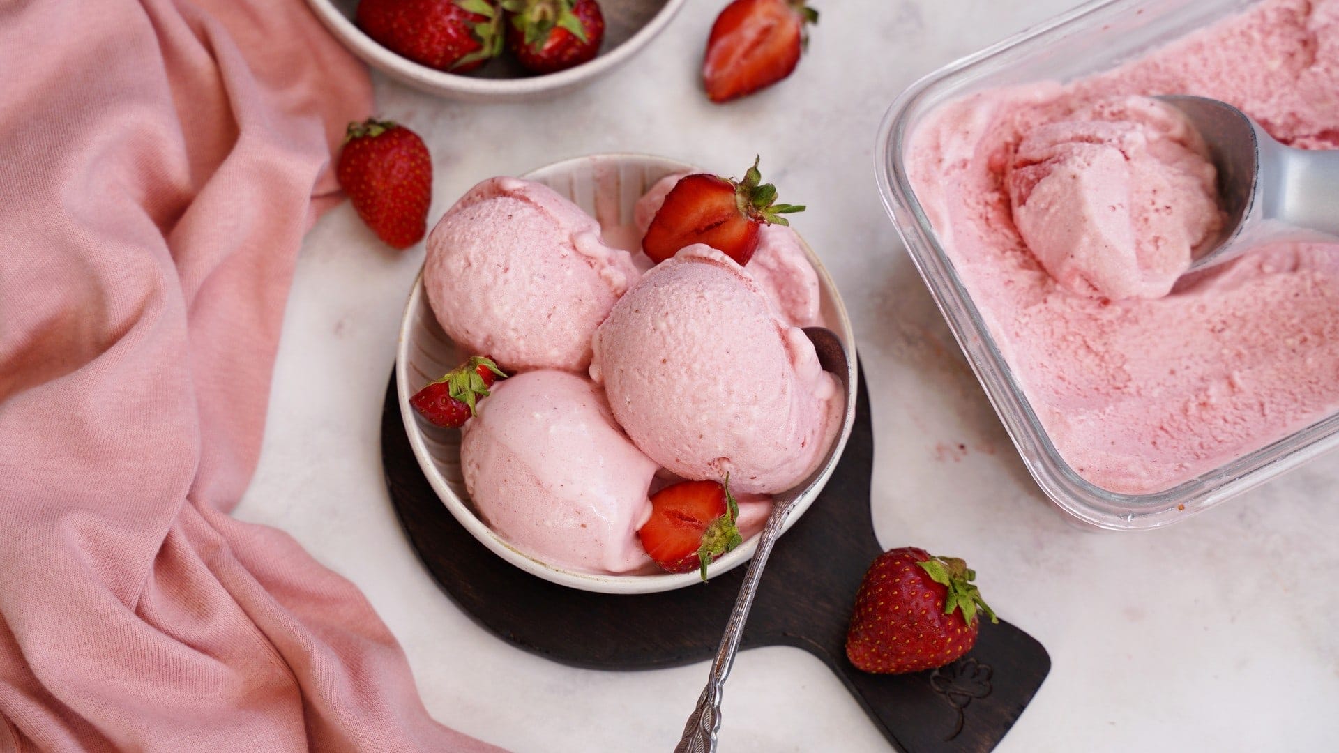 horizontal shot of strawberry ice cream in small bowl