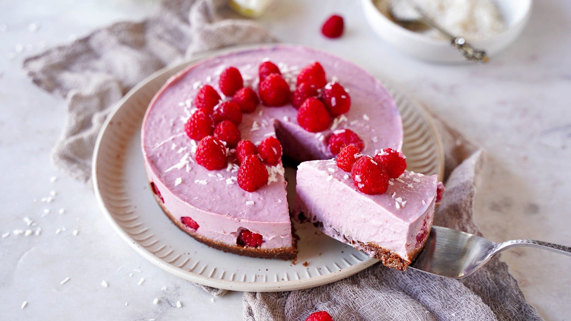 horizontal shot of vegan no-bake raspberry cheesecake